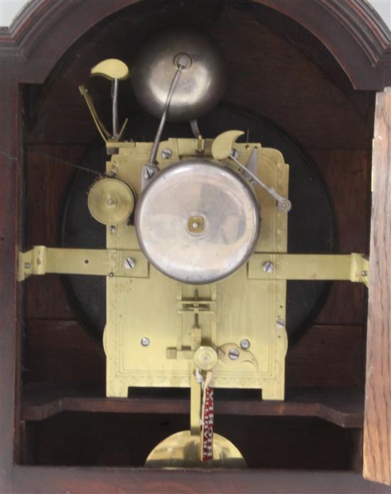An early 19th century single pad top mahogany table clock, height 19in.